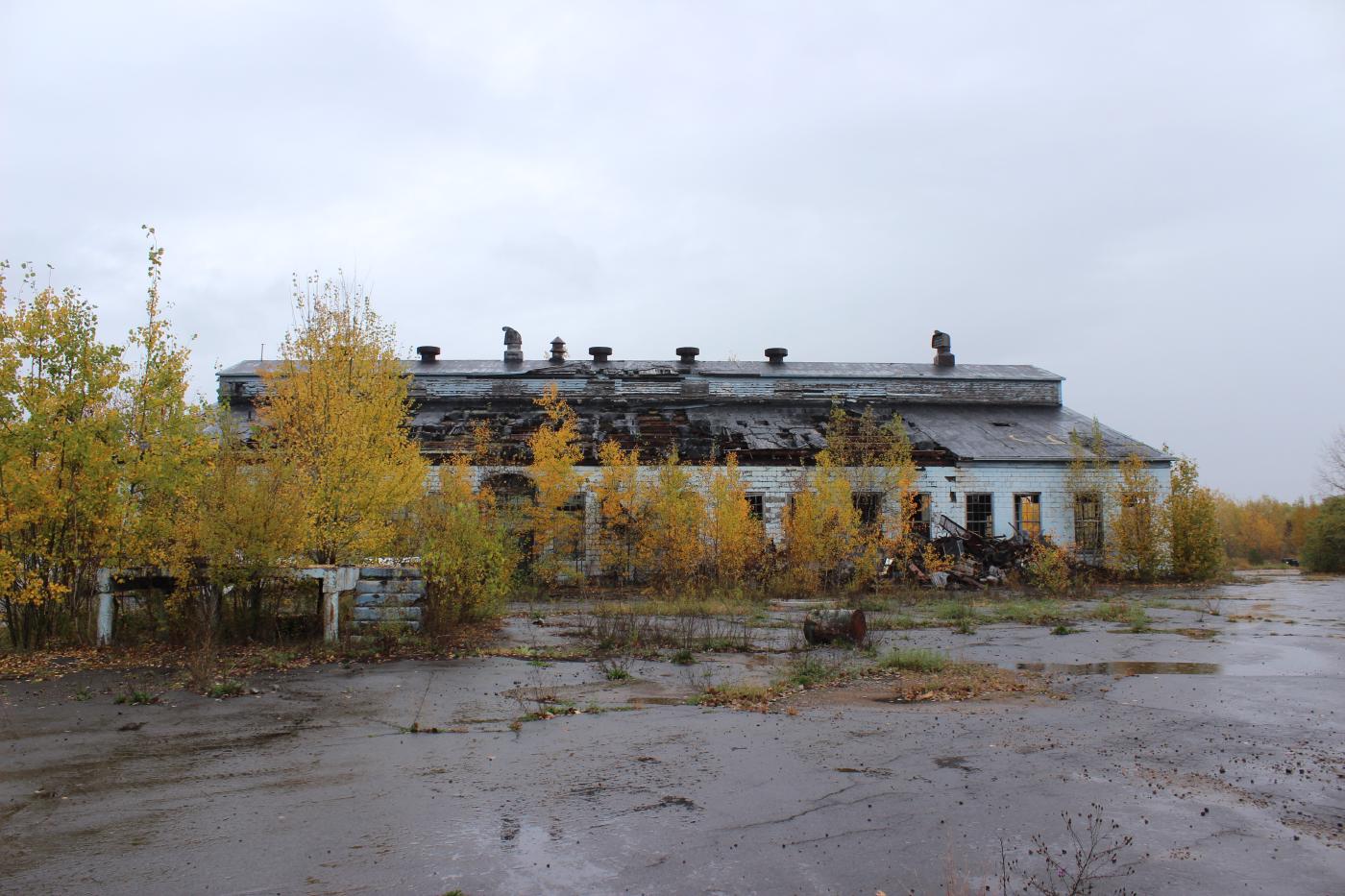 Outdoor view of the first building, the roof on this side is nearly rotted through.
